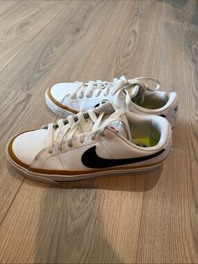 Nike White Sneakers with Black Swoosh and Brown Trim